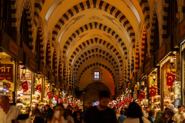 Explore the vibrant Spice Bazaar in Istanbul with colorful stalls and bustling crowds.