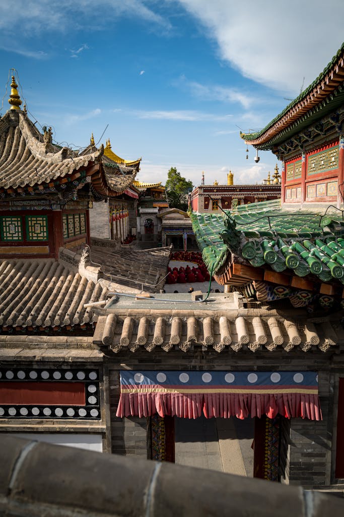 Stunning view of intricately designed Asian temple rooftops under a blue sky.